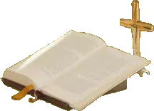 Eine aufgeschlagene Bibel mit Kreuz
